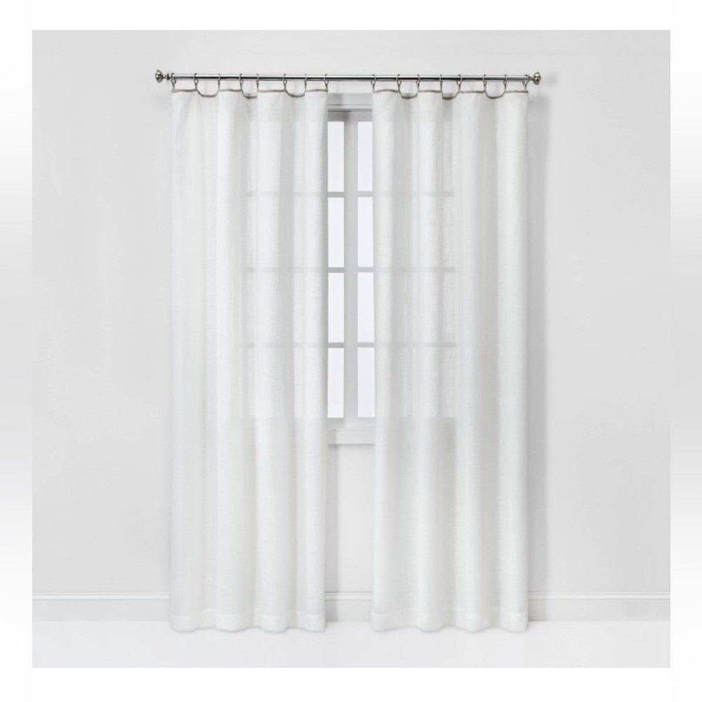 Cream curtains with metal hooks
